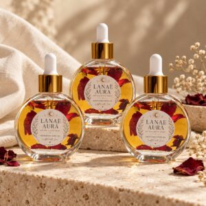 Three Aura Bloom body oil bottles